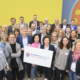 Gruppenfoto der Regionalbotschafter vor dem temps Schulungszentrum in Neustadt. Die Botschaft: Es braucht eine ganzheitliche Unterstützung der Geflüchteten